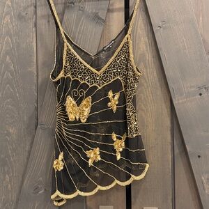 Beautiful Butterfly baby doll sheer asymmetrical top.